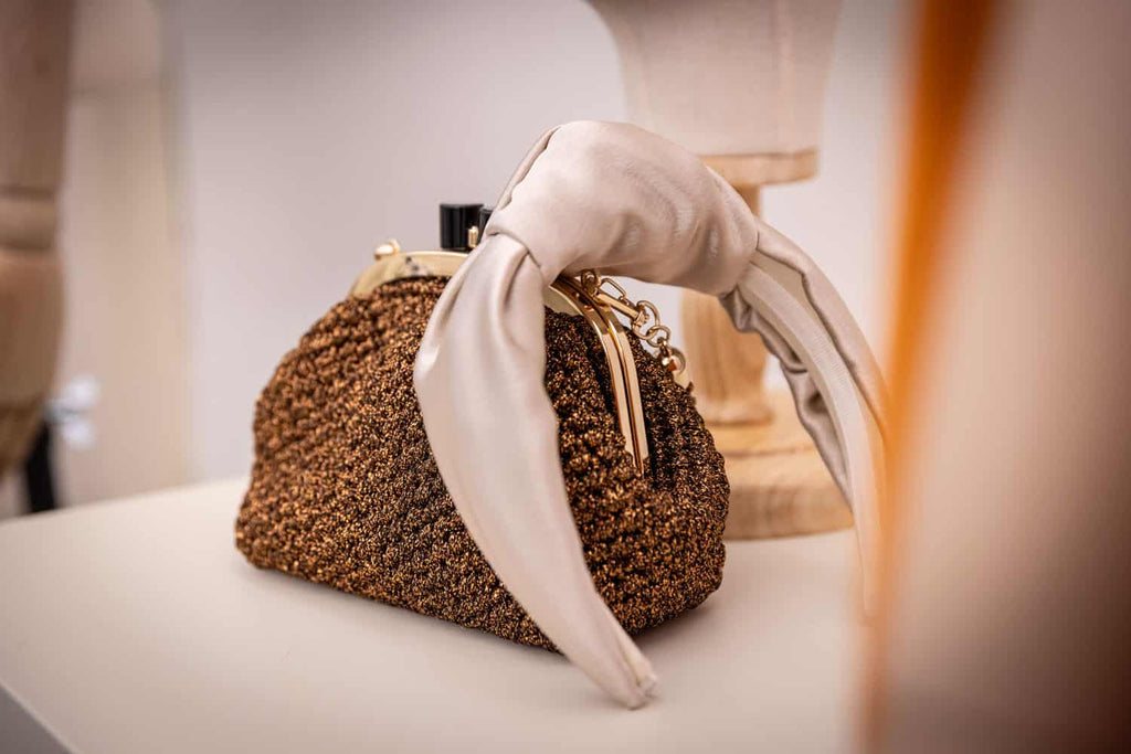 Clutch "Costiera" tricot marrone lurex